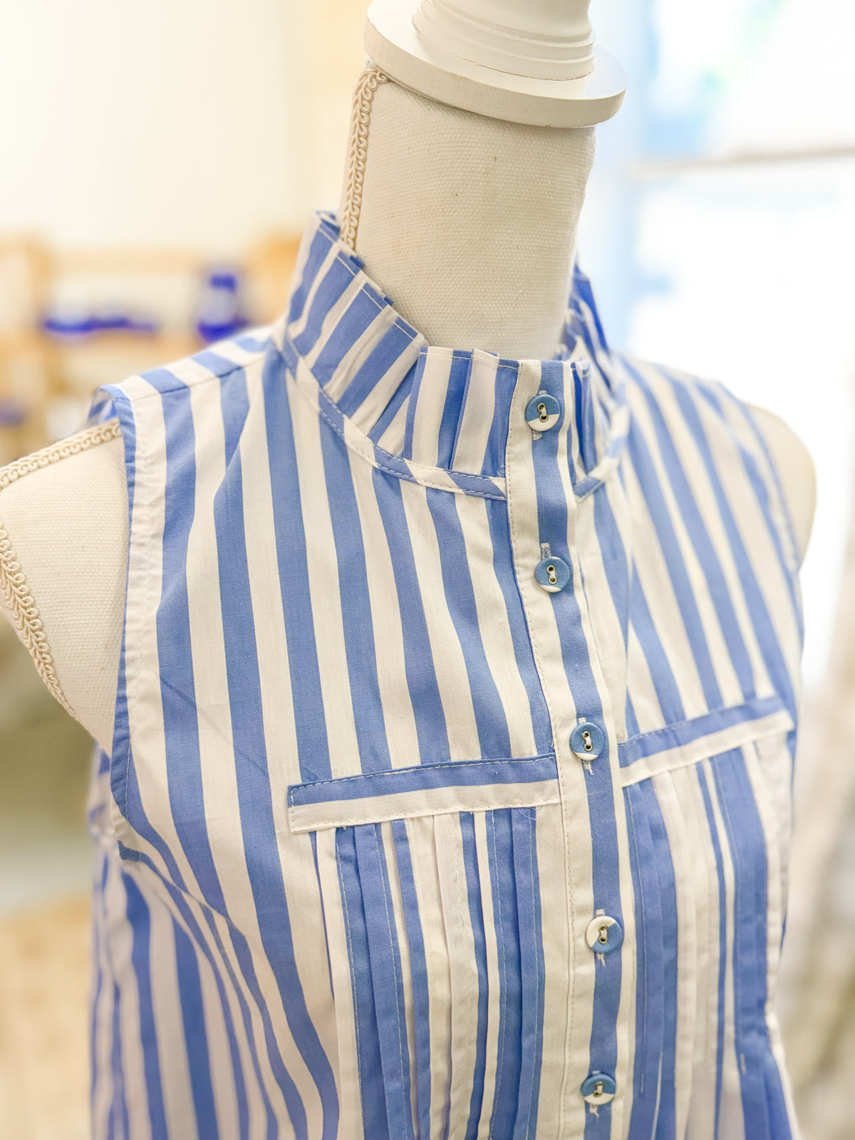 Blue and White Striped Sleeveless Blouse with Ruffle Neckline and Pintuck Detail