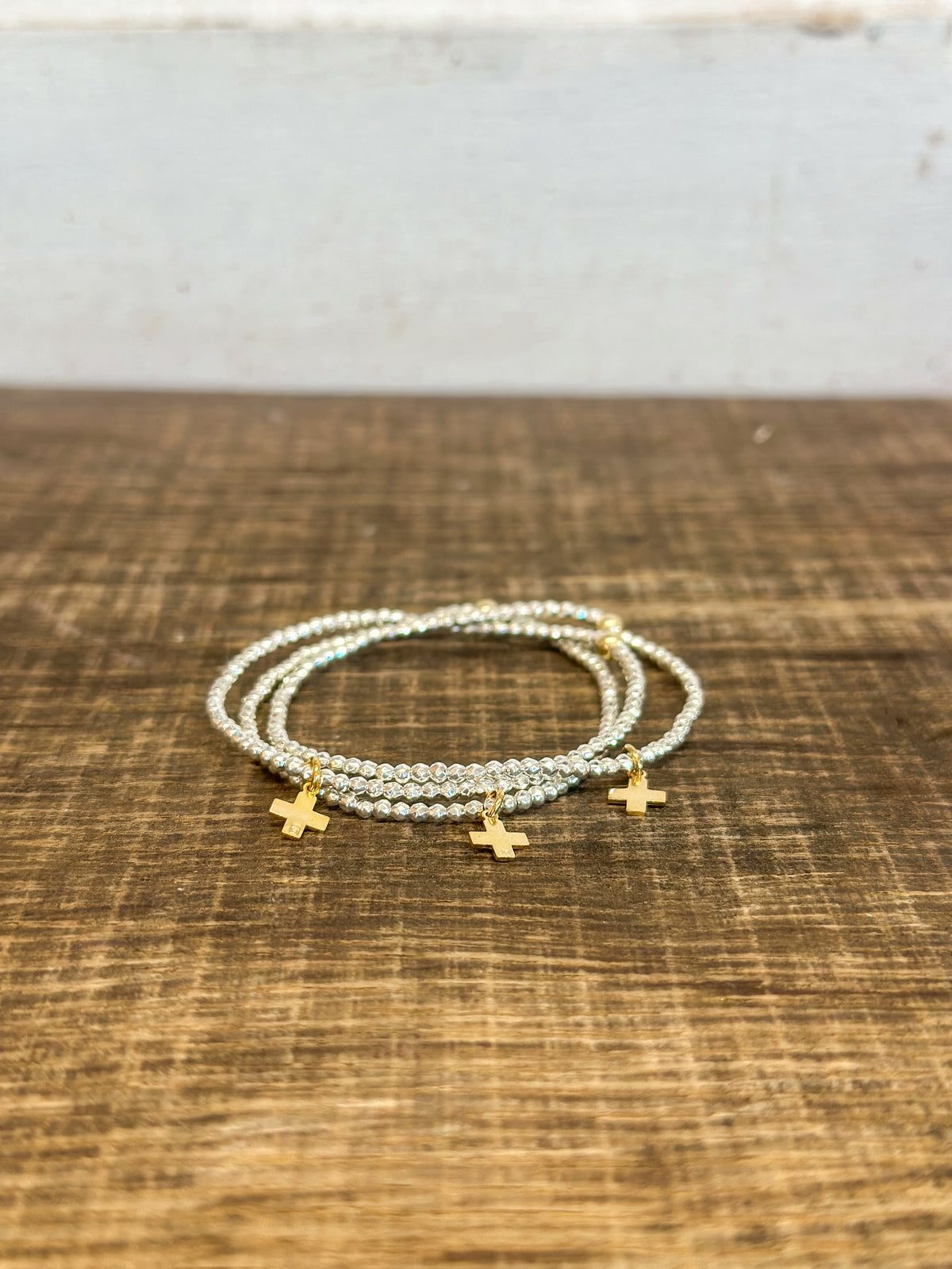 Bright Silver Faceted Hematite 2mm Bead Bracelet - Signature Cross Gold Charm